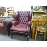 Red leather studded and button back wing side armchair