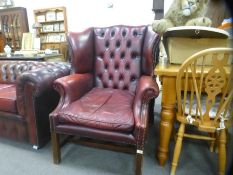 Red leather studded and button back wing side armchair