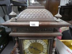 Early 20th Century bracket clock, oak cased with finials above