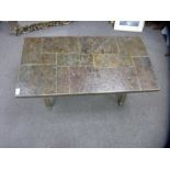 Heavy tile top rectangular coffee table on a wrought metal base