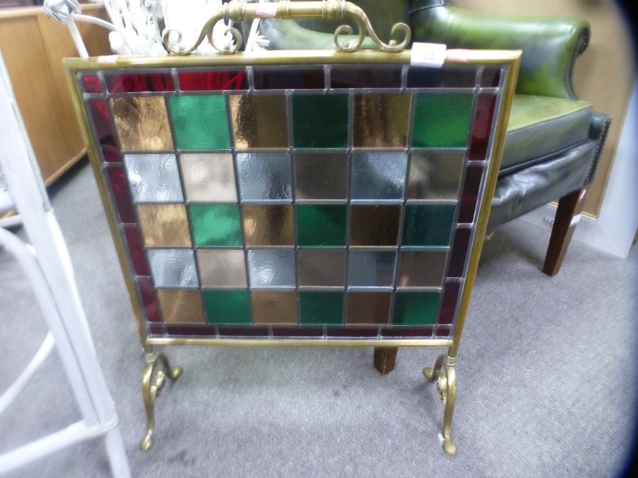 Ornate brass fireguard inset with stained glass panels of various colours