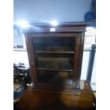 Antique mahogany glazed cupboard with ormolu decoration