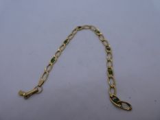 18ct yellow gold bracelet inset with green stones, clasp broken, marked 750