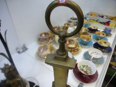 Vintage brass door stop on mahogany base together with vintage ormolu lamp in the form of a Hindu de