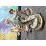 Continental figure of a young boy with catapult on brass plinth, another similar model of a girl and