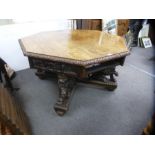 Superb example of a Gothic Revival carved octagonal center table, Circa 1900, with 4 drawers support