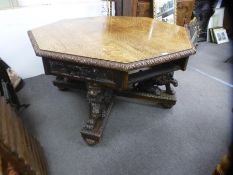Superb example of a Gothic Revival carved octagonal center table, Circa 1900, with 4 drawers support