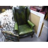 Vintage green leather buttoned and studded wingback armchair