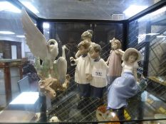 Shel of Nao model figurines to incl. choir boys, violinist, birds etc