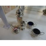 A quantity of silver items comprising of sugar sifter, salts and a salt shaker. Various hallmarks, t