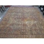 Large middle eastern cream and red decorated carpet, very worn condition, 135inch x 119inch