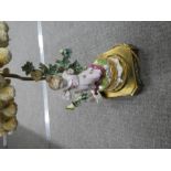 Continental lamp with mounted porcelain figure of a girl with butterfly on brass plinth