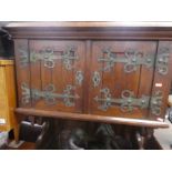 Oak Arts and Crafts dresser small proportions with cupboards above on turned supports