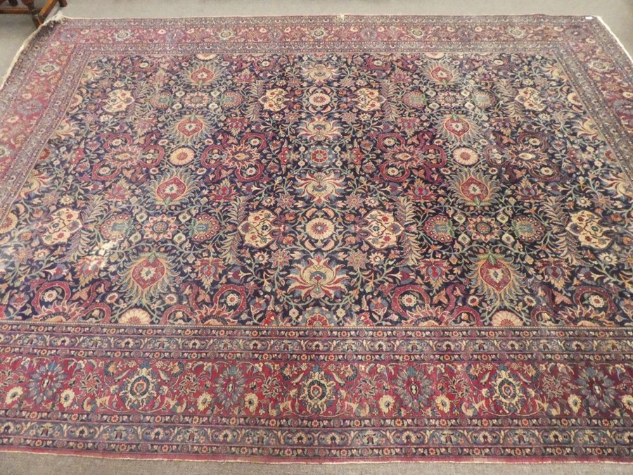 Large blue ground floral bordered oriental carpet 147 x106 inch  areas of wear and small tear - Image 2 of 5
