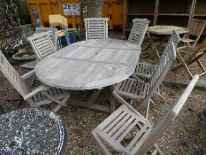 Good quality weathered teak oval extending garden table complete with set 8 folding chairs incl. 3 c