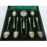 A cased set of Victorian six silver teaspoons, silver sugar tong and silver tea strainer. Hallmarked