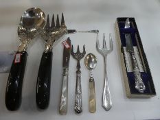 A quantity of silver flatware to include mother of pearl handled fruit knife and spoon, silver handl