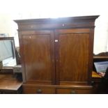 Victorian mahogany linen press with cupboards above drawers on bracket supports