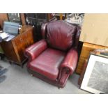 Thomas Lloyd Oxblood leather armchair on castors