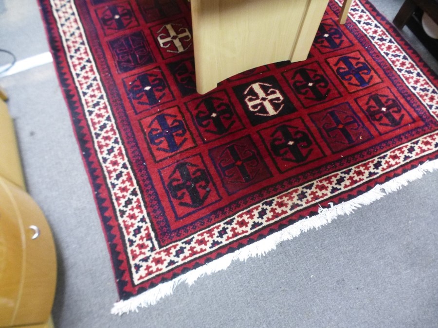 A modern Afghan rug decorated geometric squares, 251cm x 168cm