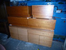 Teak sideboard with cupboards and drawers, similar low two drawer example and a pair of single drawe