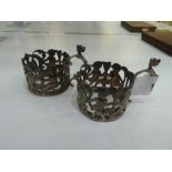 A very interesting, decorative pair of silver Victorian napkin rings of pierced design. With animal