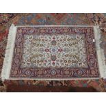 Cream decorated small fringed rug 29x52 inch, and a red geometric designed middle eastern carpet 44x