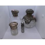 An ornate and decorative set of silver bottles and silver topped AF. Pierced and decorative design w