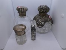 An ornate and decorative set of silver bottles and silver topped AF. Pierced and decorative design w