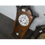 Antique mahogany wall hanging pendulum clock with enameled dial
