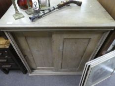 Stripped pine floorstanding cupboard with sliding doors