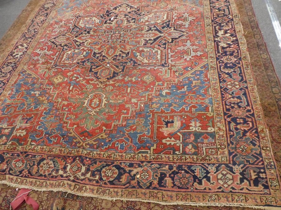 Large middle eastern red ground rug of geometric design with central motif  areas of wear, 129inch x - Image 4 of 4