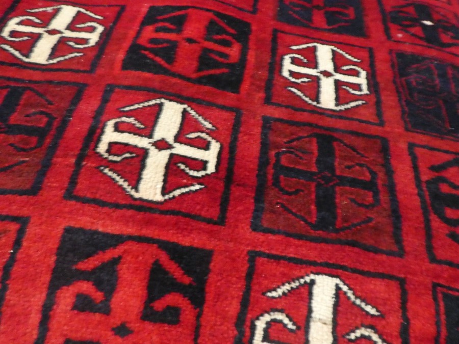 A modern Afghan rug decorated geometric squares, 251cm x 168cm - Image 4 of 5