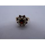 9ct yellow gold garnet and seed pearl cluster ring, size O, marked 375, 2.3g