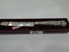 A very interesting Victorian silver fruit knife of ornate and decorative design on handle and blade.