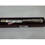 A very interesting Victorian silver fruit knife of ornate and decorative design on handle and blade.