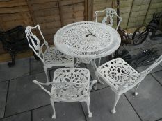 White painted cast iron garden set of 4 chairs and a table