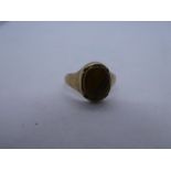 9ct gold signet ring with oval tigers eye inset in a yellow gold mount, marked 375, size H, gross we