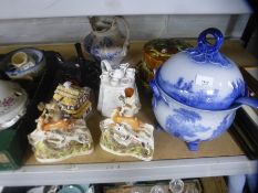 A pair of 19th century Staffordshire figures, novelty tea pots, Majolica style, a cake cover and a b