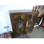 An Oak leaded glass bookcase by Jentique