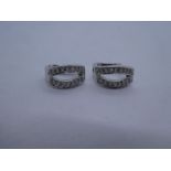 Pair of 18ct white gold huggie diamond set earrings, each earring with 16 small diamonds, hallmarked