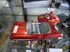 A vintage tin plate model car and a Dodzsen example