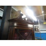 A Victorian in laid corner mahogany cabinet with glazed top above cupboard