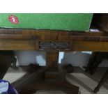 An antique rosewood fold out card table