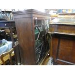 A mahogany floor standing bookcase with glazed doors