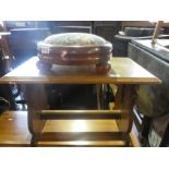 An oak coffee table and mahogany footstool