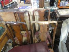 Four mahogany dining chairs upholstered in red fabric