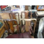 Four mahogany dining chairs upholstered in red fabric