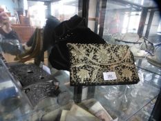 A vintage ladies embellished clutch bag and three hats