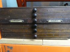 A vintage table top, with collectors bank of six drawers